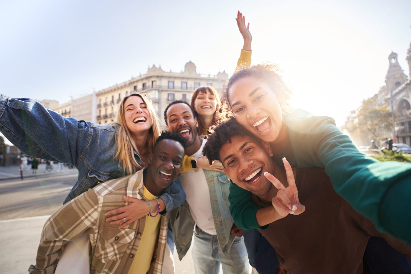 A group of cheerful college student friends having fun together as they travel through European cities during a semester abroad.