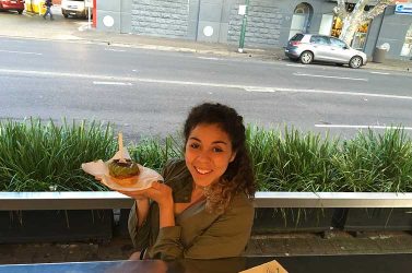 Denae enjoying food at Harry's Cafe de Wheels