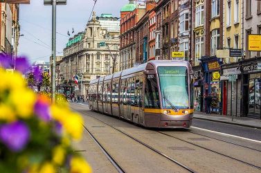 A bus travels through the streets of Dublin