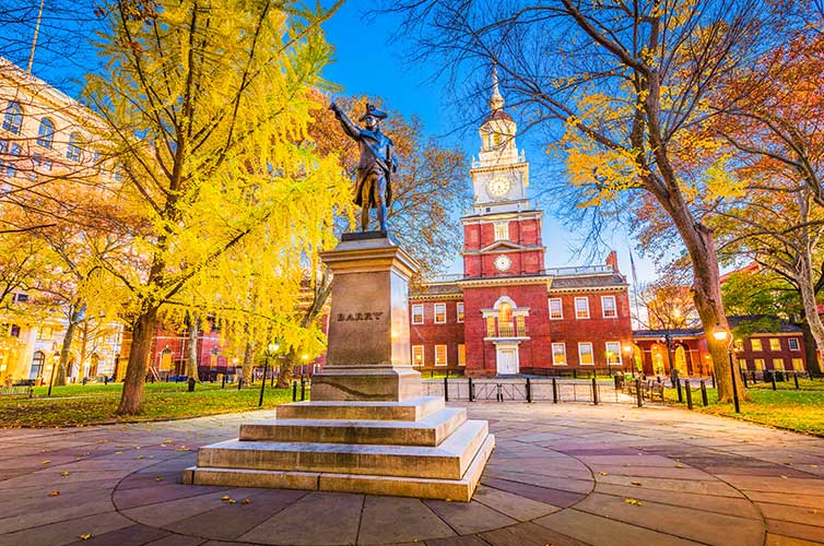 Statue of Commodore Barry in Philadelphia, Pennsylvania with the leaves changing in fall - Philly is a great destination for weekend getaways.