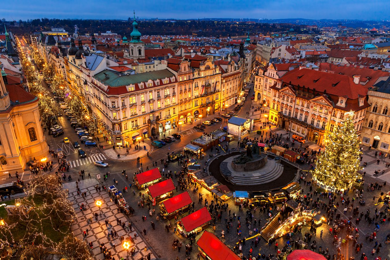 View from above a traditional Christmas market at Old Town Square illuminated and decorated for holidays in Prague – one of the best destinations in Europe for students, capital of Czech Republic and fifth most visited European city.