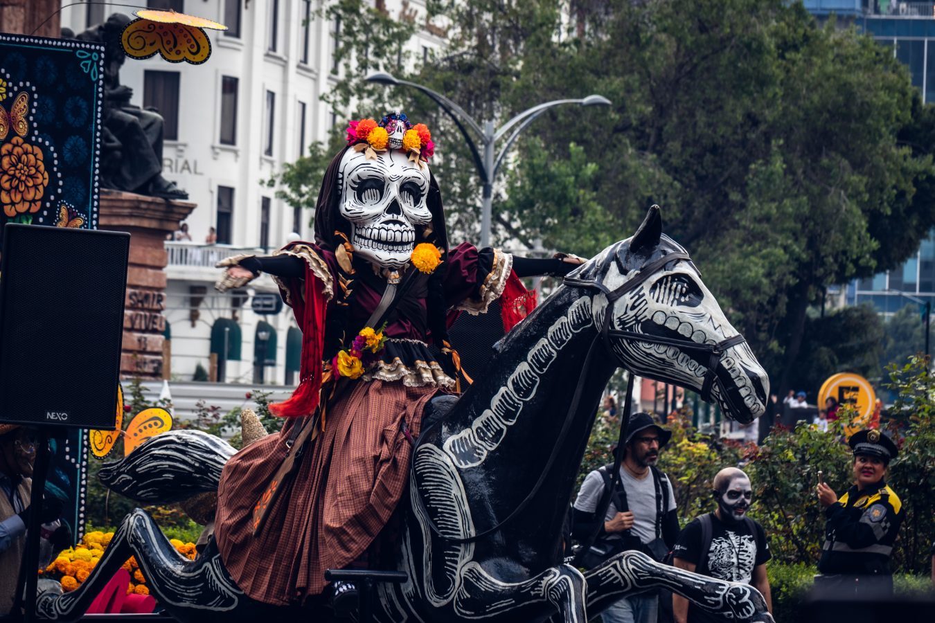 Skull costume on horse float in Dia de los Muertos parade.