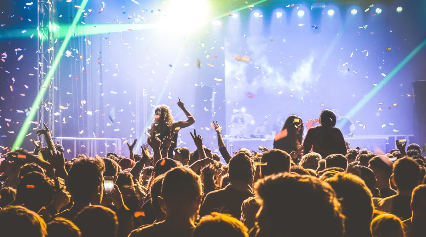 Young people dancing at night club - like in Ibiza, Spain (one of the top party destinations in the world).