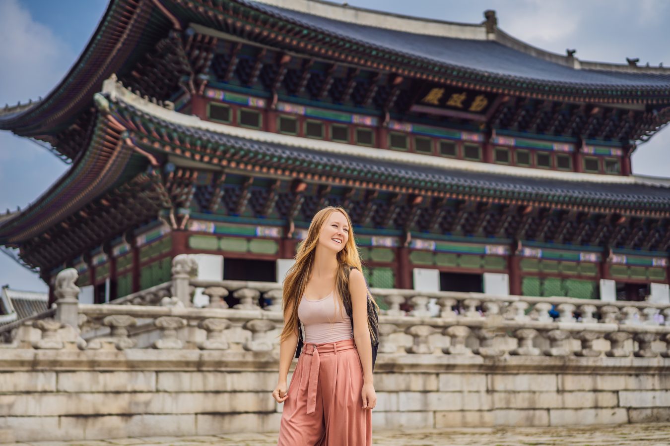 Woman tourist in korea. Korean palace grounds in Seoul, South Korea. Travel to Korea concept.