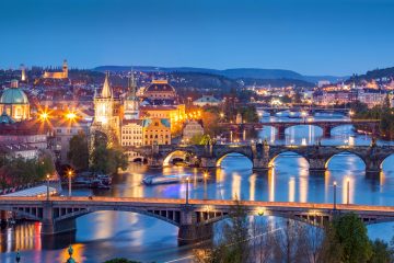 Prague, Czech Republic bridges panorama with historic Charles Bridge and Vltava river at night