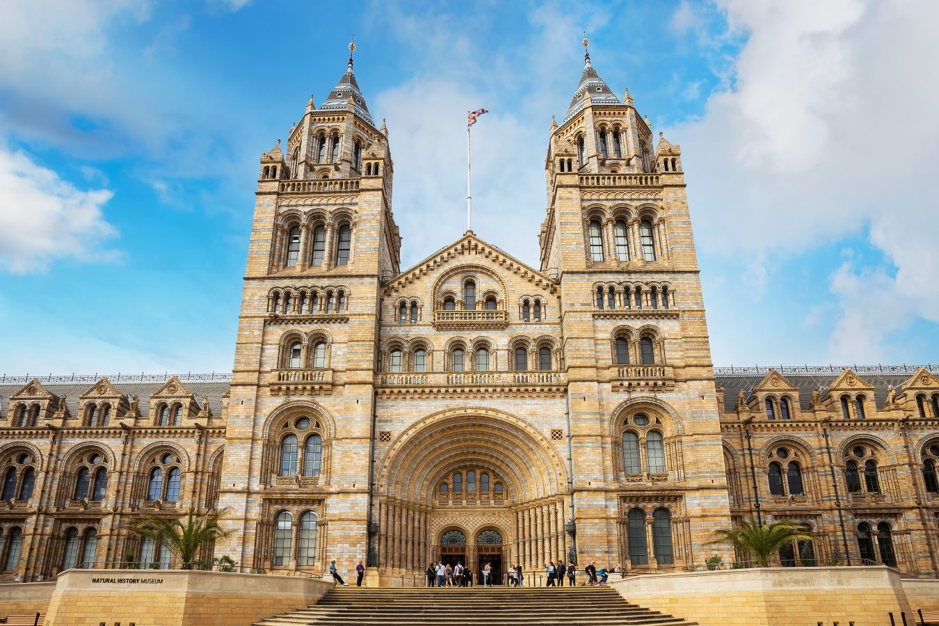 The Natural History Museum in London, UK on a blue sky day.