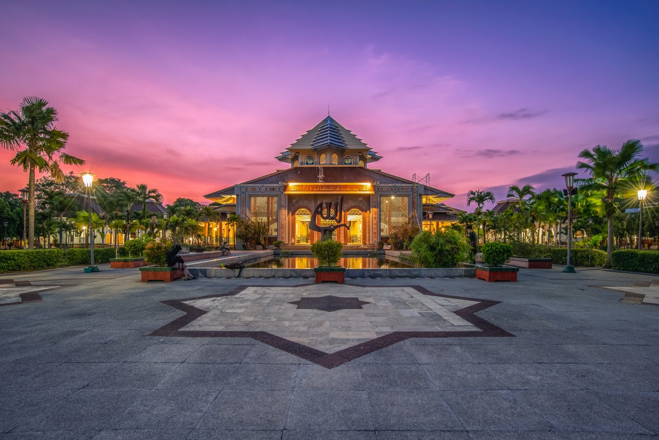 Masjid Kampus UGM Yogyakarta, Indonesia with an dusk purple sky.