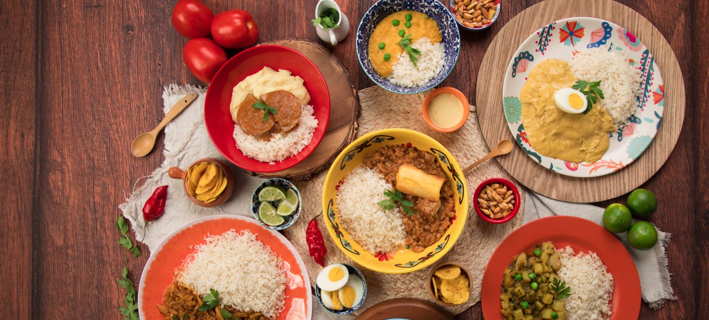 Assorted Peruvian food dishes laid out on a table showing some of the cuisine of Latin America.