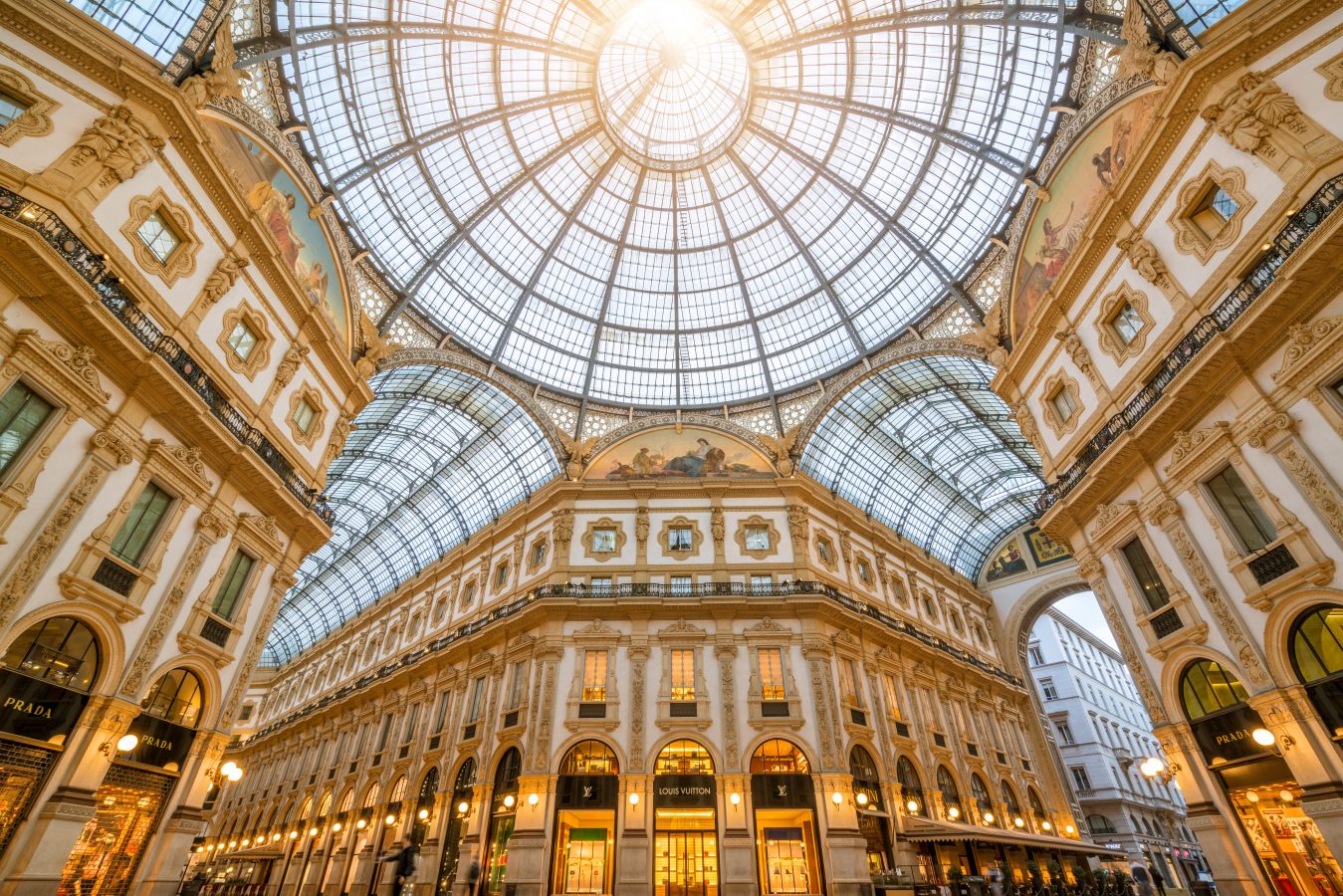 A look up at the window dome of the Galleria Vittorio Emanuele II in Milan, Italy which is the oldest shopping mall of Milan.