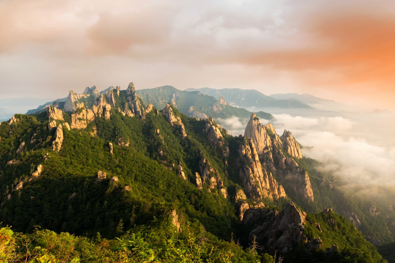 Seoraksan mountains is covered by morning fog and sunrise in South Korea.