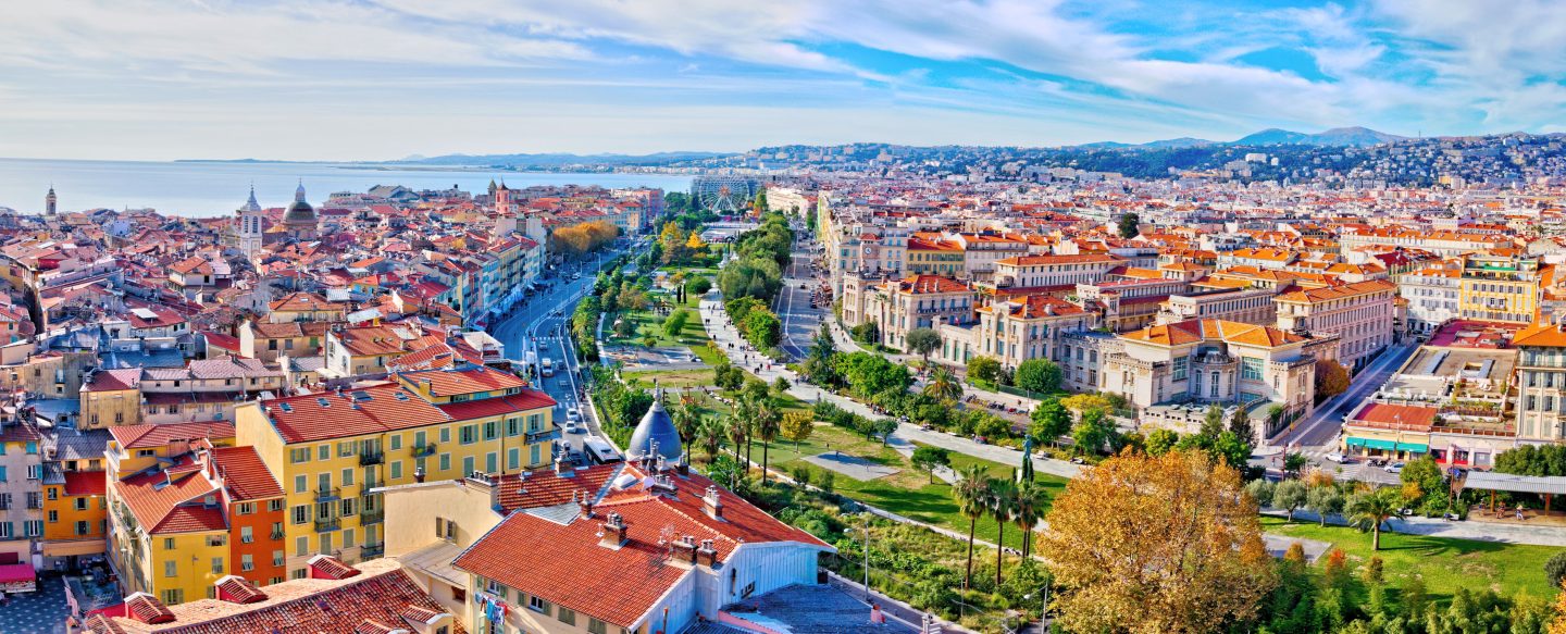 Aerial view of Nice, France with colorful buildings on a sunny day.