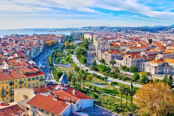 Aerial view of Nice, France with colorful buildings on a sunny day.