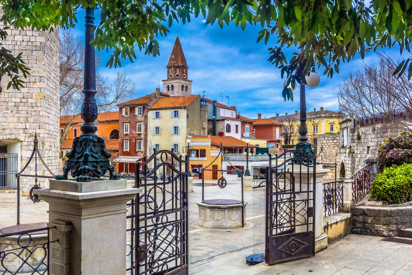 view at old roman public square with ancient five wells as a symbol of town, in Zadar, Croatia -  a popular destination for young adult travelers to visit in for European summer.